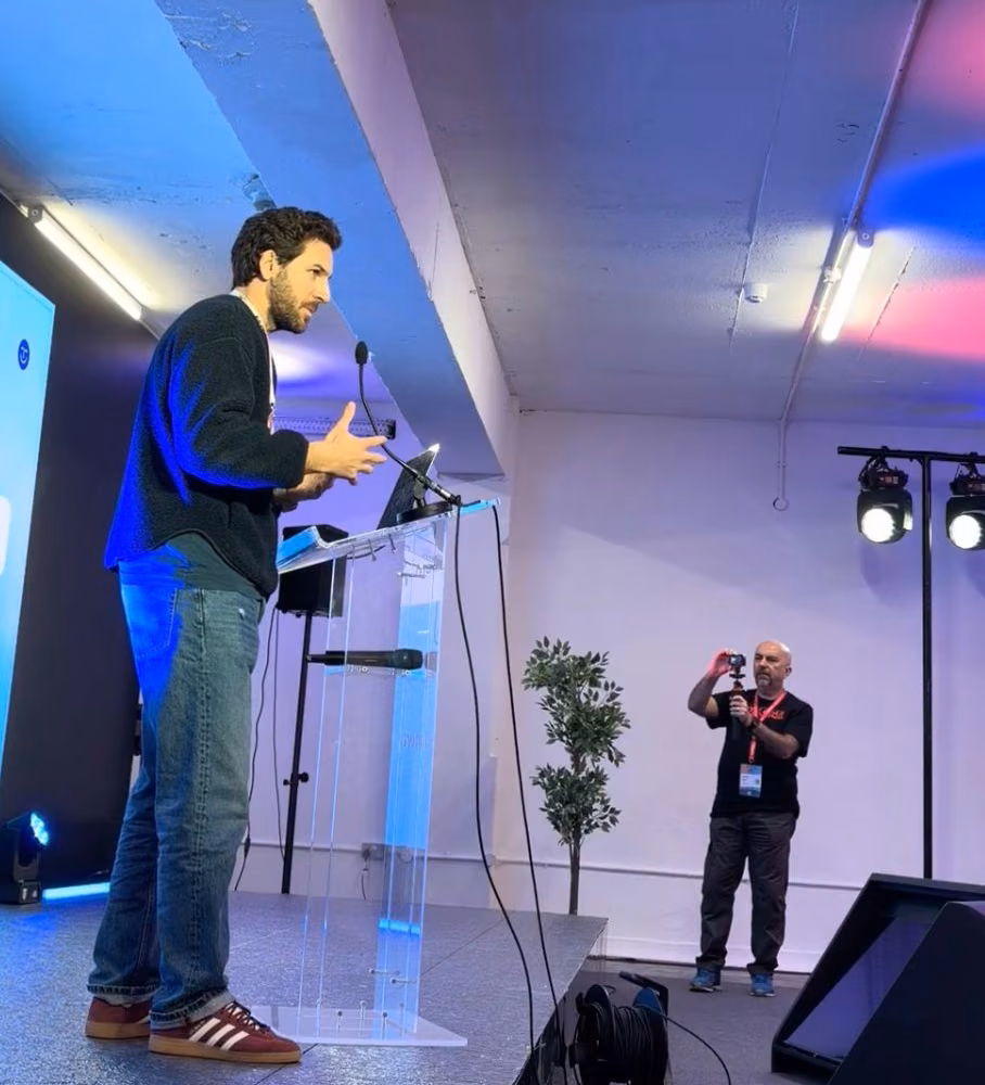 Teo, Ogment's CEO, presenting on stage